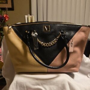 Elegant Black and Tan Tote with Gold Chain